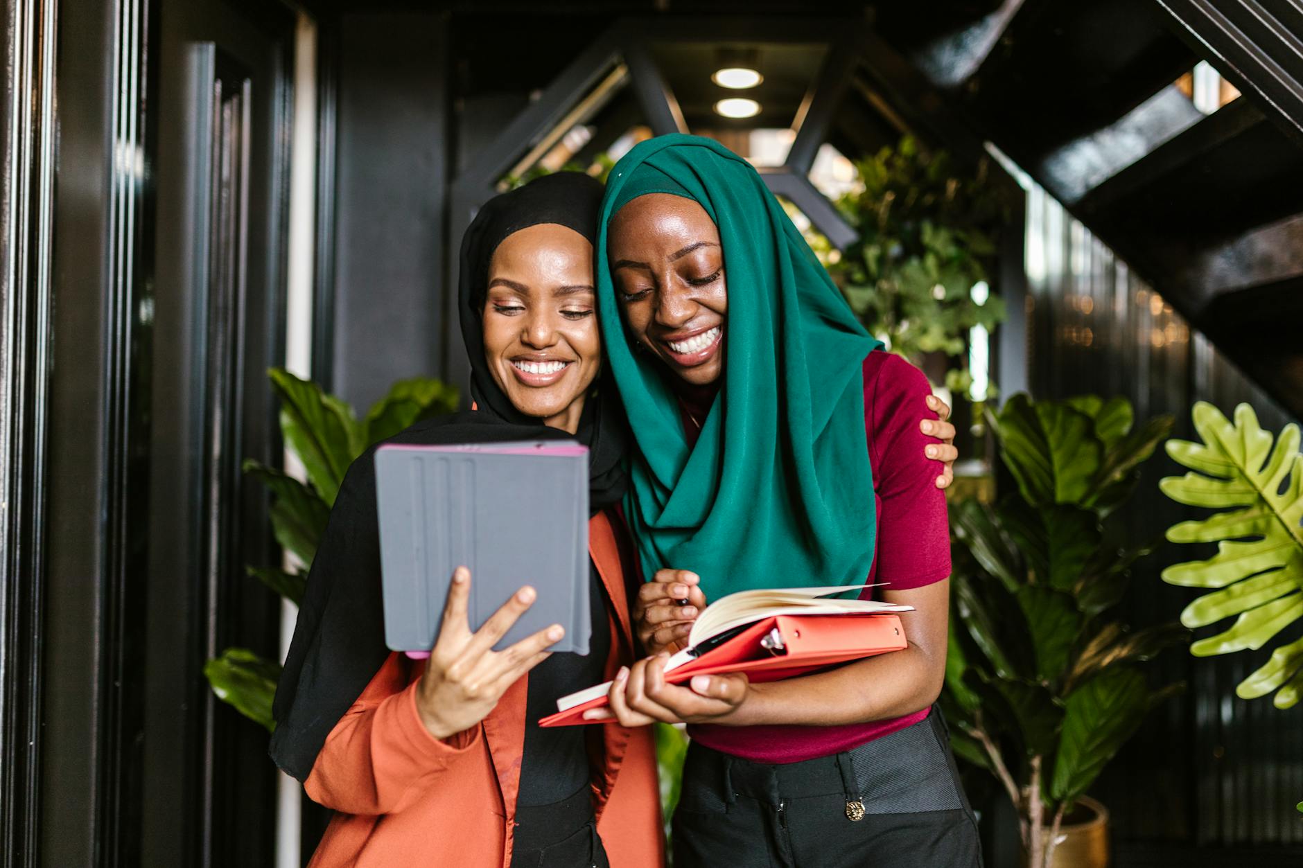 women in hijab working in an office