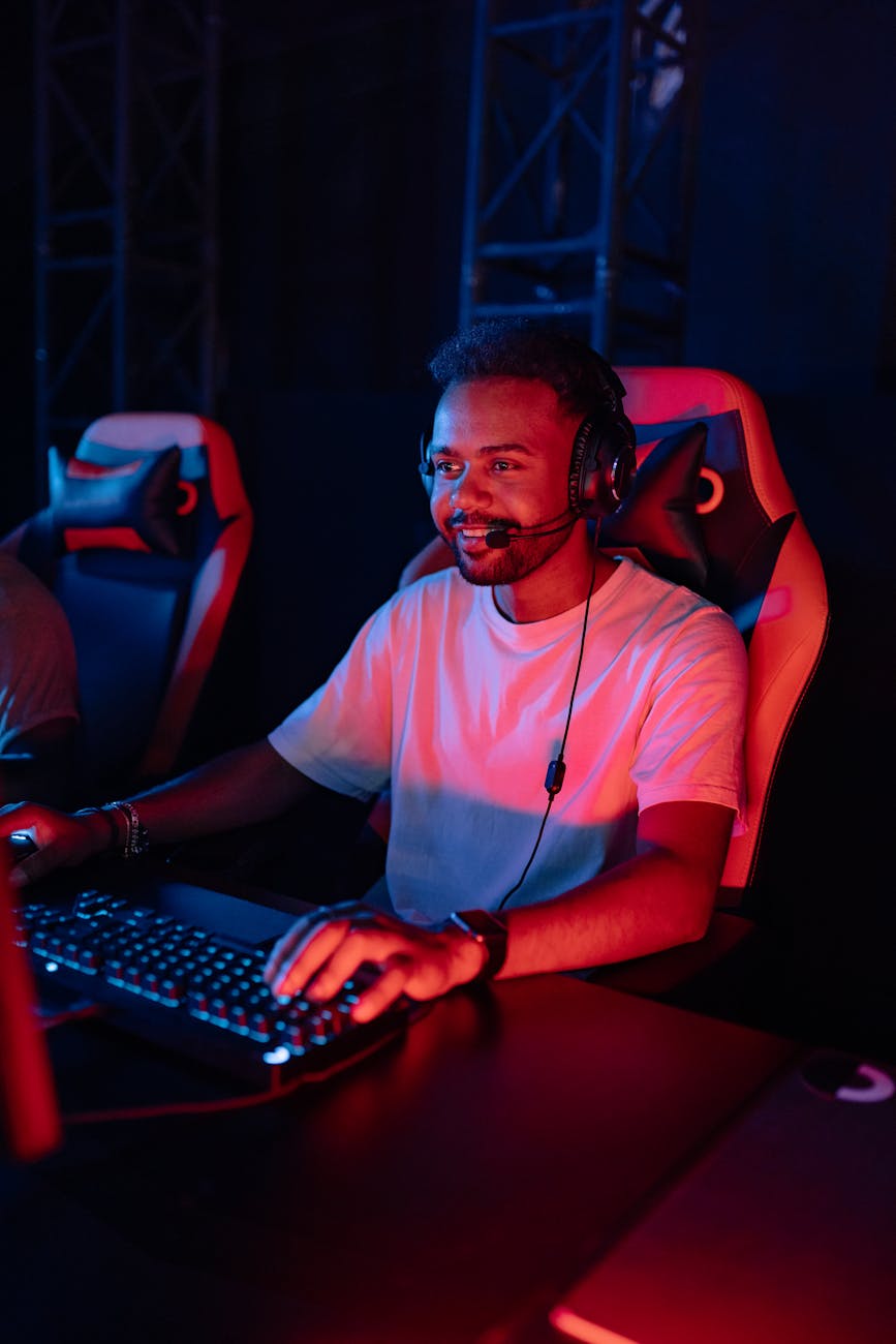 a man in a white shirt gaming on a desktop