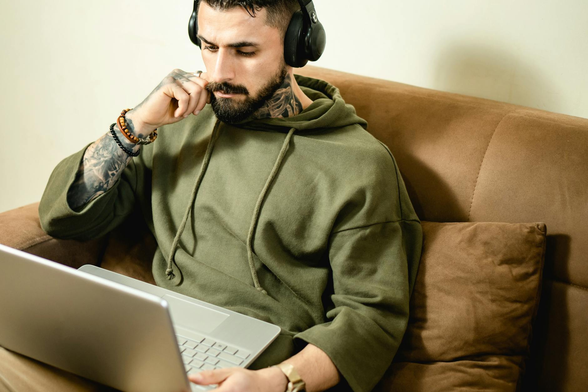 absorbed man looking at his laptop