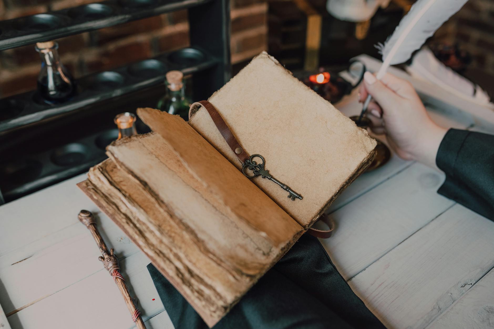 close up shot of a person writing on a spell book