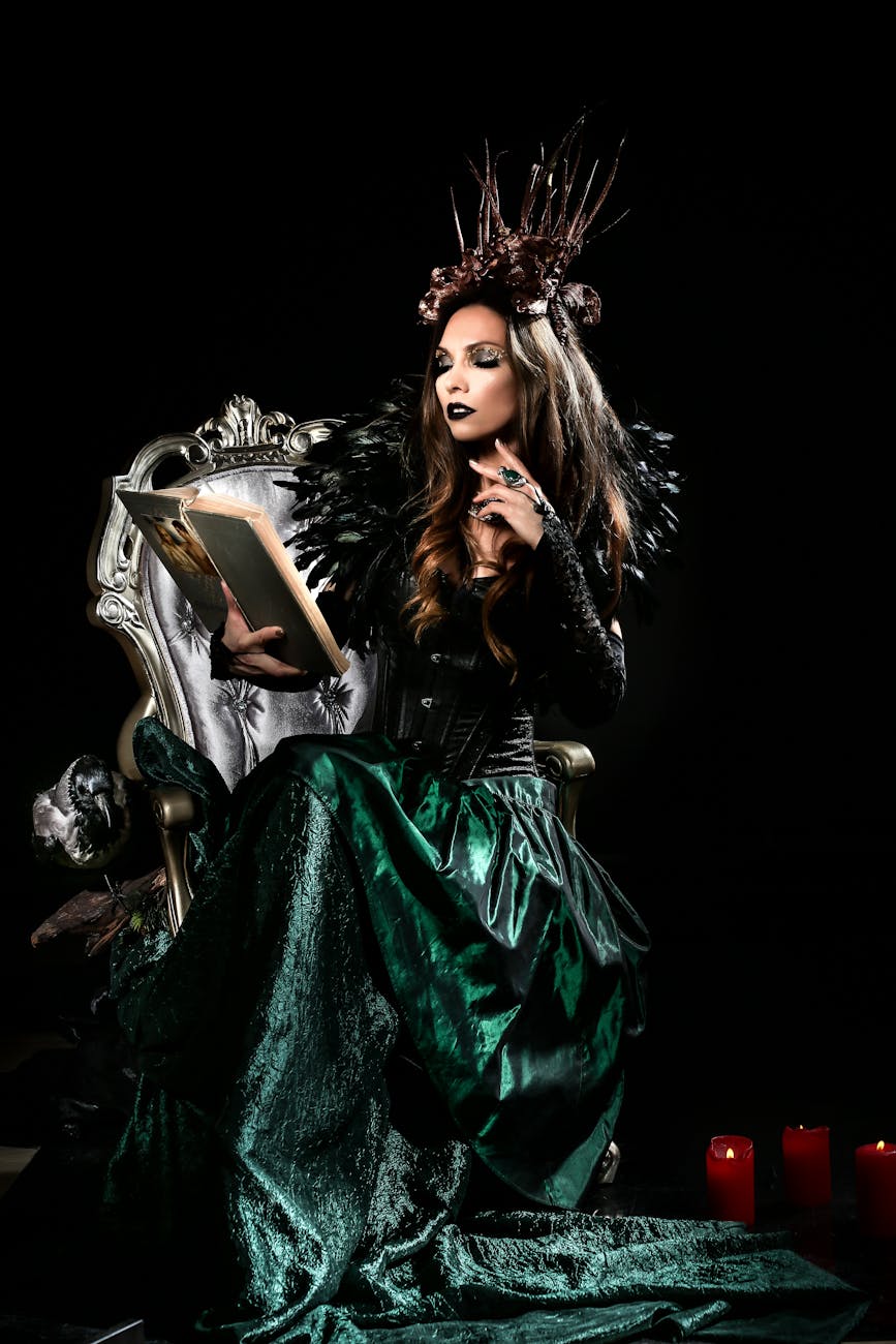 woman in a costume reading a book