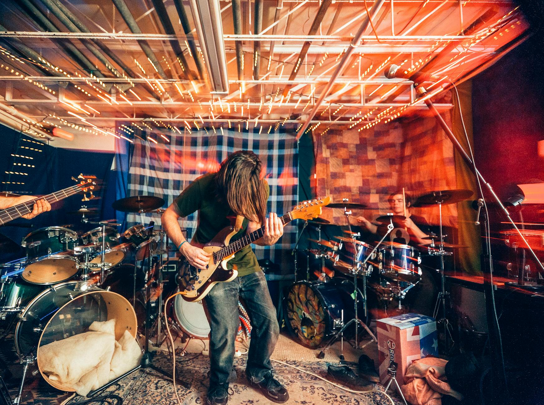 photo of man playing guitar